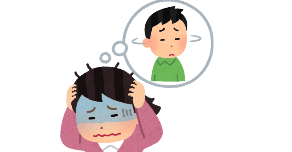 頭を抱えて青ざめた表情の女性