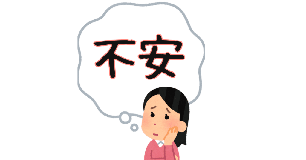 左手を頬にあて、不安そうな表情の女性